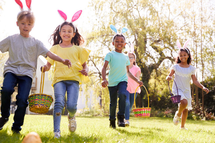 Five young children participating in an Easter egg hunt | Blog | Greystar
